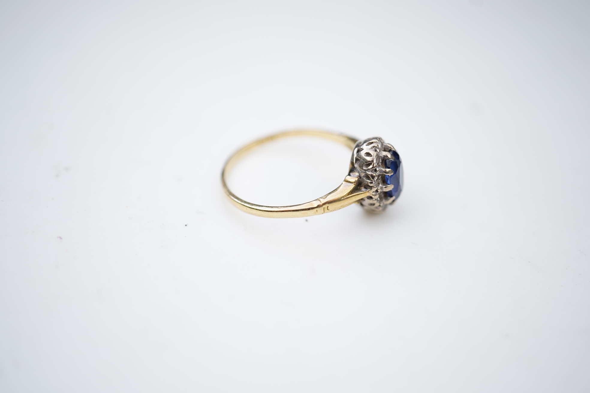 A synthetic sapphire and diamond cluster ring, mid 20th century